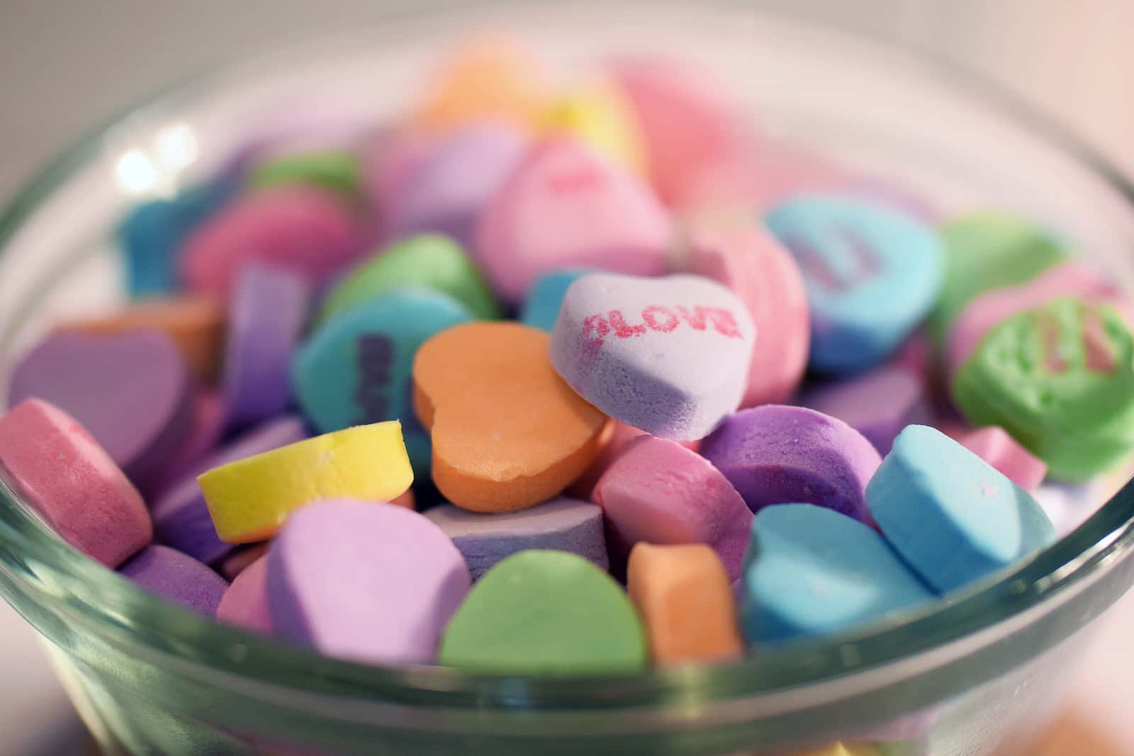 A bowl of Valentine's Day hear-shaped candy.